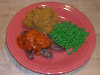 Lamb with Red Pepper Sauce, Sweet Potatoes, and Peas