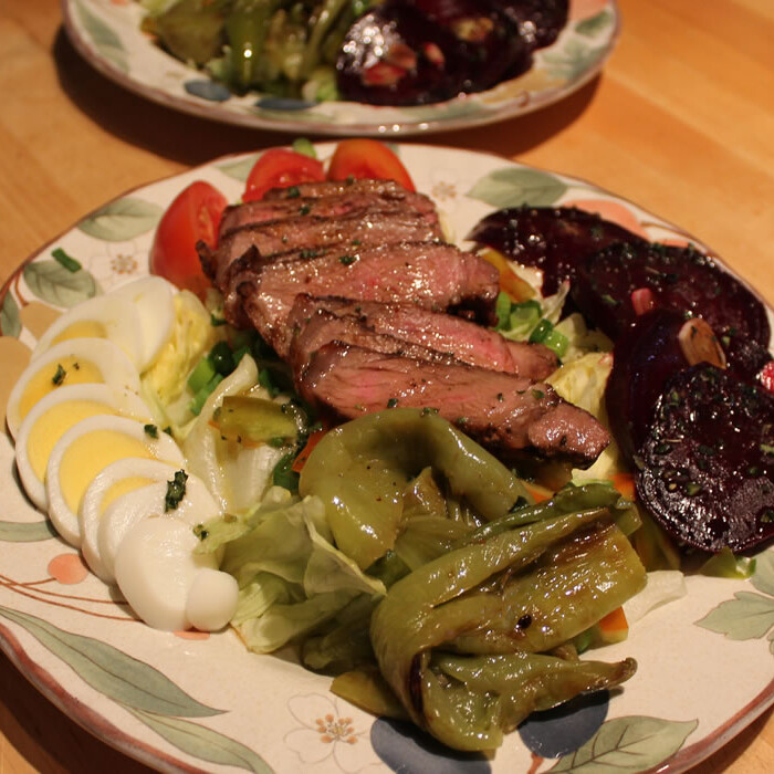 salads with steaks, beets, and peppers.